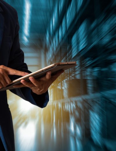 Businessman manager using tablet check and control for workers with Modern Trade warehouse logistics. Industry 4.0 concept